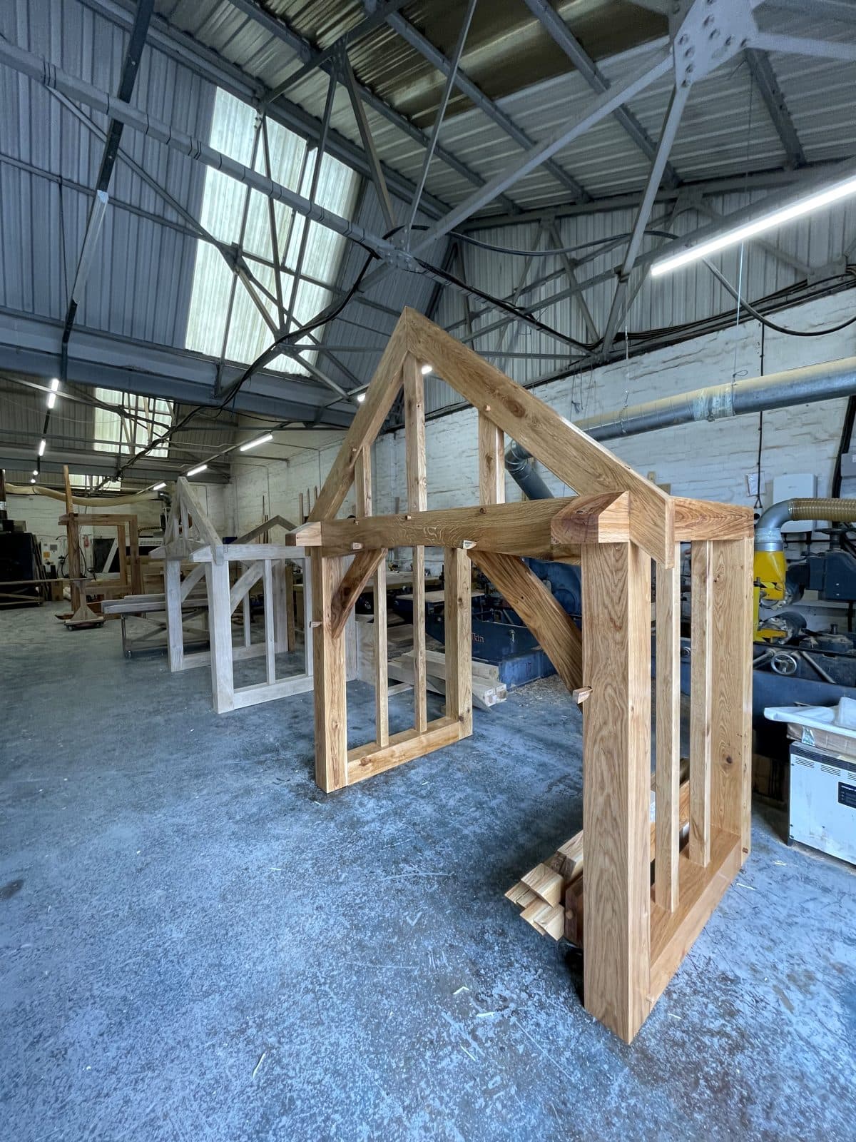 Broadway oak frame in build, side elevation with screens and gable