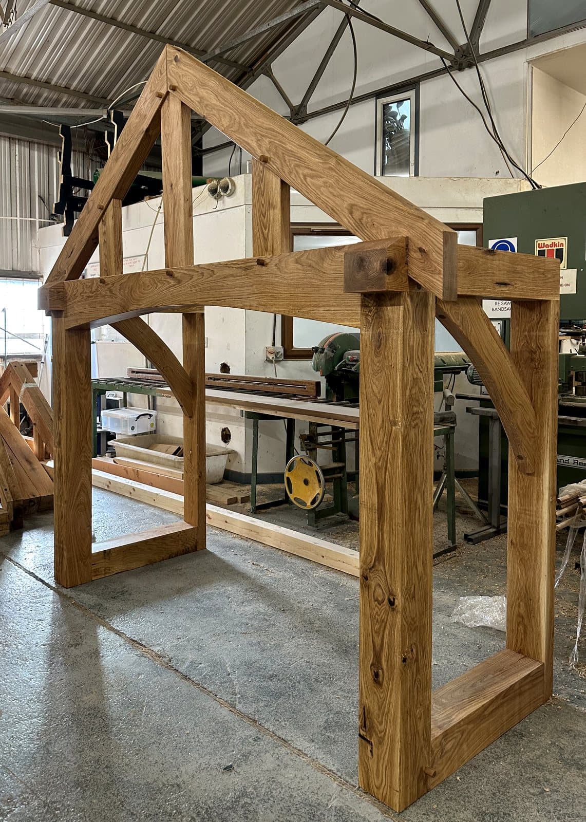 A Malvern frame dry-fitted in our Worcestershire workshop, main beam freshly oiled