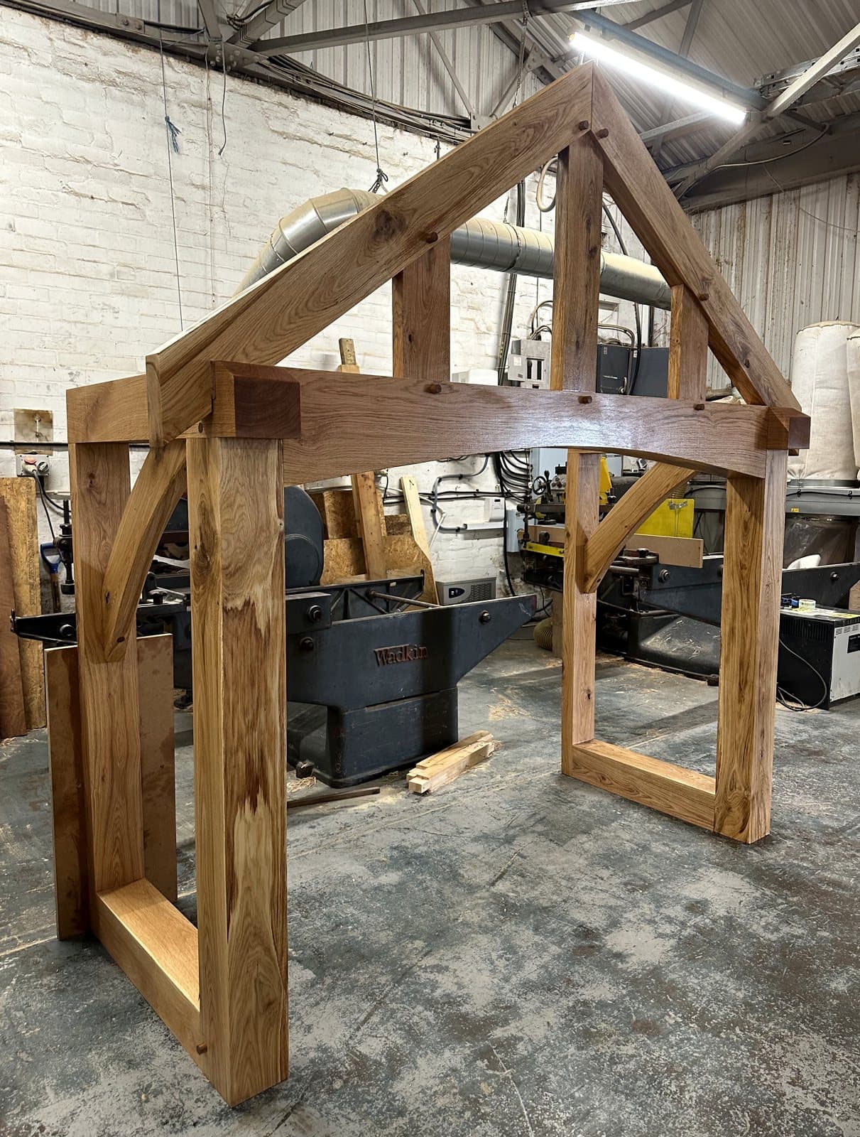 The Malvern's under-arch beam and curved braces, pegged and test-assembled in the workshop