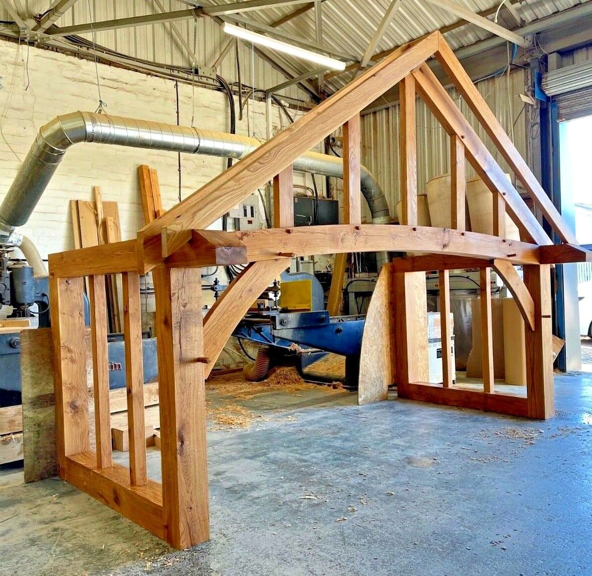 A Stroud frame dry-fitted in our Worcestershire workshop, grand curved beam and side screens assembled